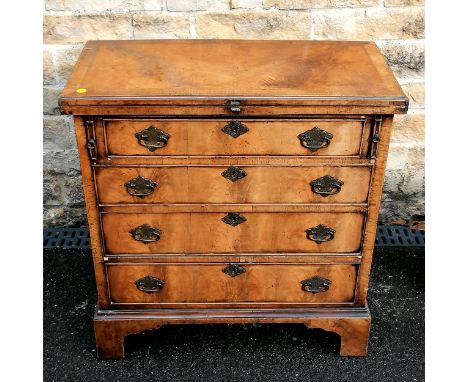 Antique flame Mahogany Bachelors 4 drawer chest on bracket feet with fold over top. Maximum width 70cm (34.5 closed) 71cm wid