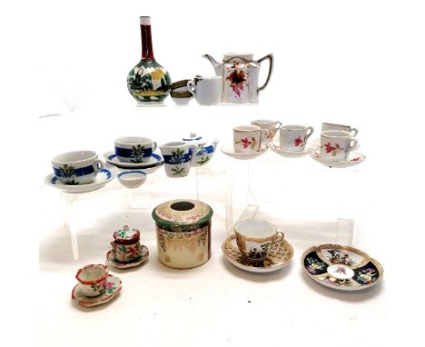 Miniature Rosenthal cup and saucer 4cm high, in good condition T/W a quantity of dolls cups and saucers etc. some A/F