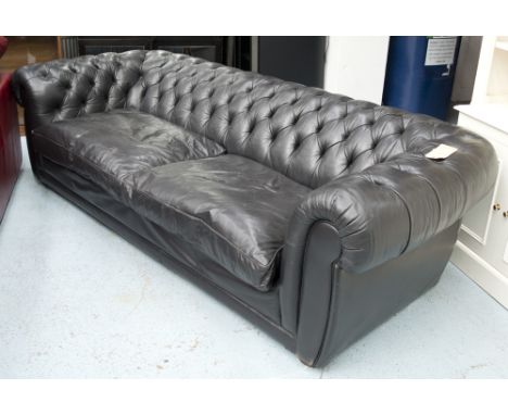 CHESTERFIELD STYLE SOFA, in distressed noir leather on bun feet, (with faults), 260cm x 110cm x 74 (approx). 