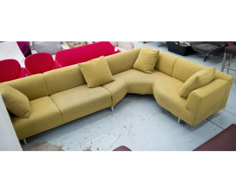 CASSINA CORNER SOFA, with a mustard fabric louse cover on tubular metal supports, 330cm x 212cm. (with faults)