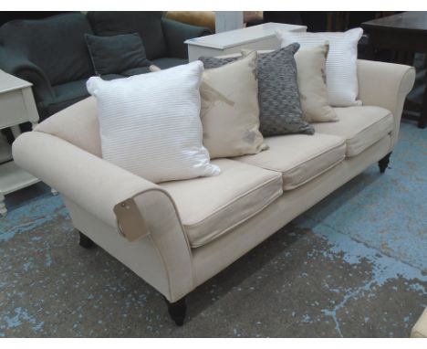 SOFA, in cream fabric, along with five cushions, from Andrew Martin, 91cm D x 77cm H x 205cm W.