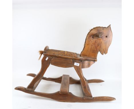A Vintage carved wood rocking horse, height 59cm 