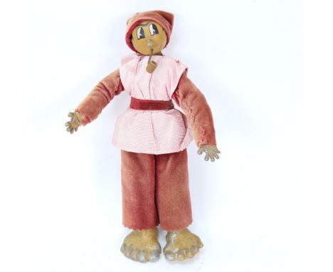 A Vintage metal-limbed cartoon toy doll smoking a pipe, height 26cm, marks on feet 