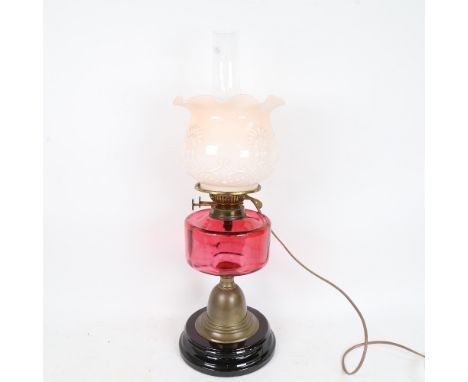 A brass Duplex oil lamp converted to electric, with cranberry glass font, frilled opaque glass shade and chimney, overall hei