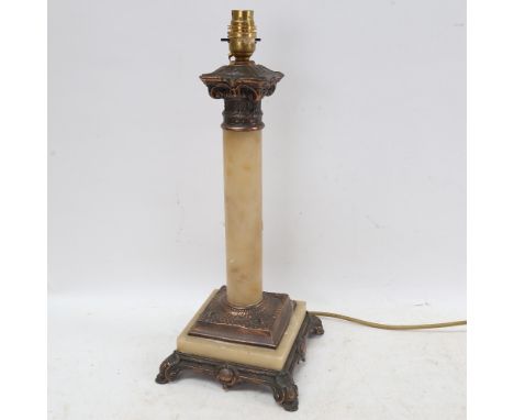 An Art Nouveau table lamp, with embossed copper mounts, height 44cm 