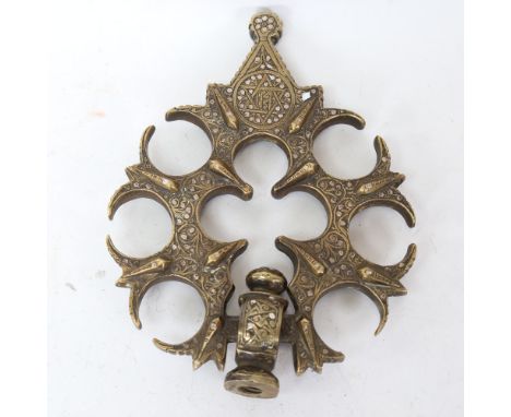 A large Middle Eastern Islamic silver inlaid cast-brass door knocker/handle, with Star of David and Scripts decoration, lengt