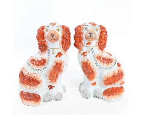 A pair of Edwardian Staffordshire Spaniels, height 24.5cm 