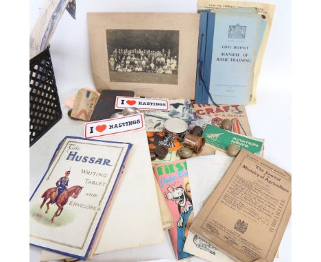 A box of ephemera, including Civil Defence Manual Basic Training, tin can craft etc 