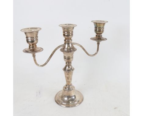 An Elizabeth II silver 3-light candelabra, with removable sconce converting to single candlestick, by Cooper Brothers &amp; S