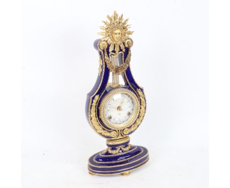 A replica Marie-Antoinette clock from the Victoria &amp; Albert Museum, gilded blue glaze porcelain in lyre form, height 36cm