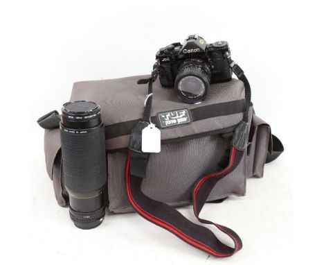 A Vintage Canon A-1 film camera, with various accessories, including Canon zoom lens 100-300mm, and soft shell carrying case 