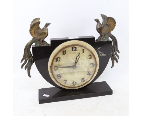 An Art Deco slate and alabaster mantel clock, surmounted by spelter birds, base length 30cm, height 32cm 