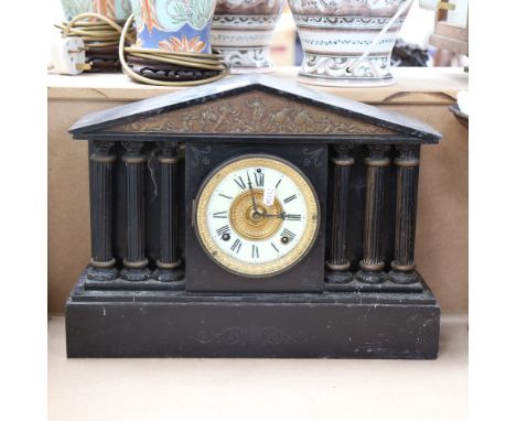 A large 19th century slate-cased architectural 8-day mantel clock, enamel dial with Roman numeral hour markers, applied embos
