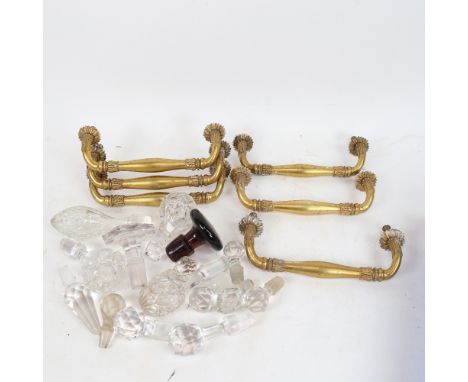 A set of 6 French gilt-brass commode handles, and a quantity of various decanter stoppers (2 boxes) 
