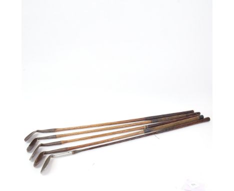5 Vintage wooden-shafted golf club irons 