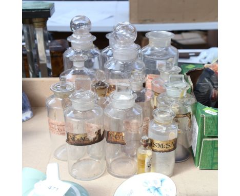 A group of Vintage apothecary glass jars and covers, some with original labels 