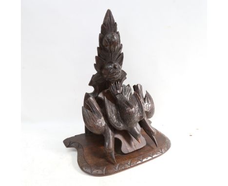 A Black Forest carved wood wall  bracket, supported by 3 birds, height 46cm 