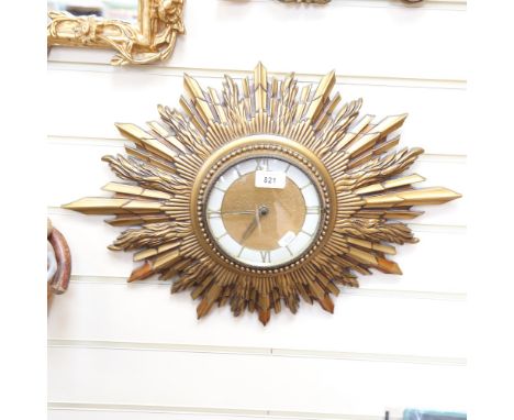 A Vintage sunburst wall clock, 54cm across 