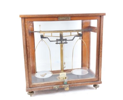 A Vintage cased set of laboratory balance scales, W42cm, H43cm 