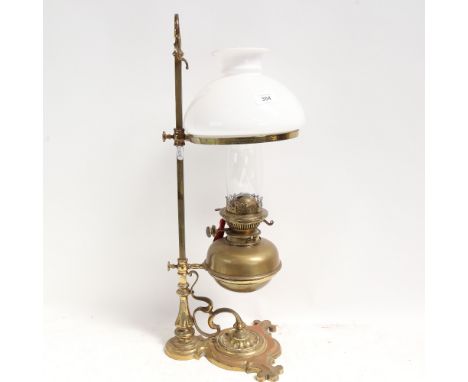 A Messenger's no. 2 brass rise and fall oil lamp, with milk glass shade and clear funnel, column height 64cm 