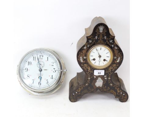 A Vintage ship's bulkhead clock, marked NV Observator Rotterdam, and a brass and mother-of-pearl inlaid ebonised 8-day mantel