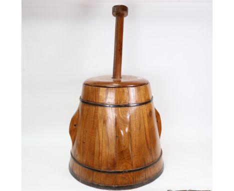 A Vintage stained pine apple press with plunger 