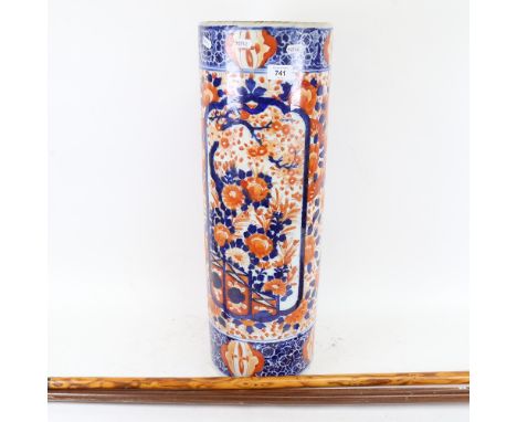 3 walking sticks, and an Oriental Imari style stick stand, height 63cm 