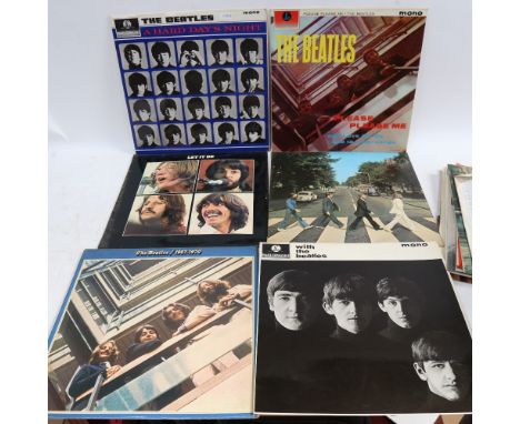 A collection of vinyl albums, including The Beatles, Rolling Stones and Pink Floyd 