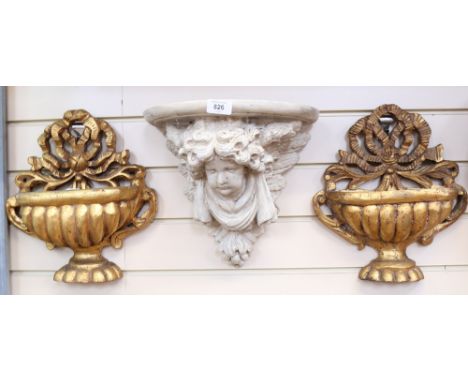 A composition wall bracket, with angel support, height 28cm, and a pair of gilded composition wall vases, with ribbon pedimen