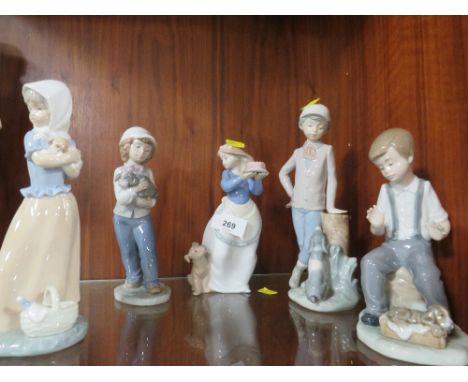Five Nao figurines of girls and boys with dogs 