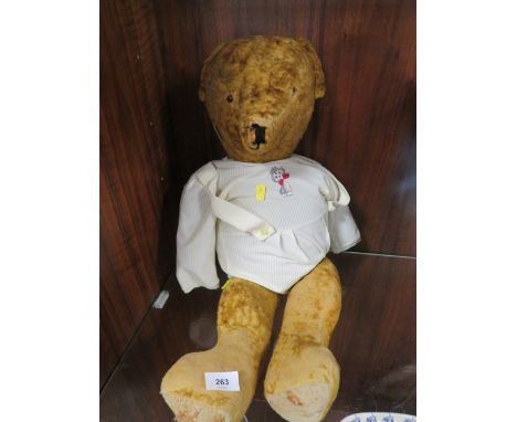 A vintage jointed teddy bear 
