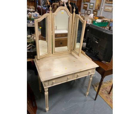 A vintage cream painted dressing table with triple mirror 