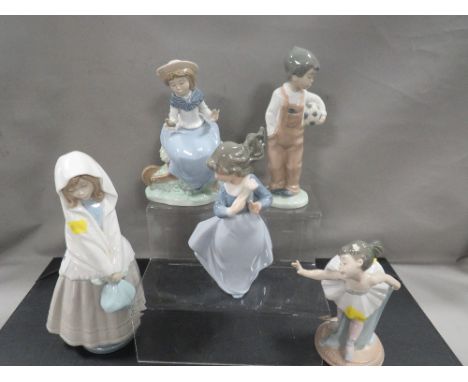 Five Nao figurines to include girl ballerina, boy with football etc