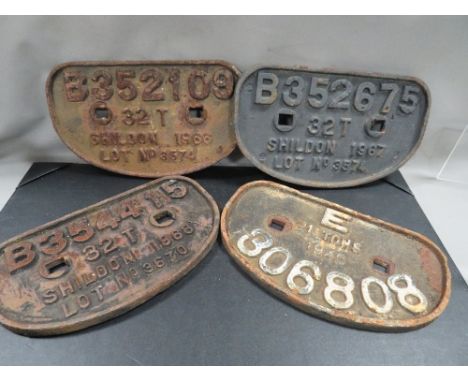 Four vintage / original cast iron wagon plates 