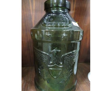 A green glass churn with American eagle motif 