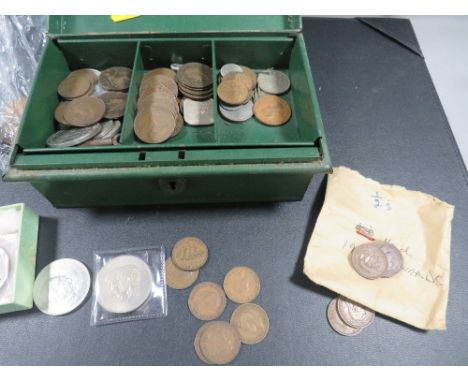 A vintage tin cash box of coins 