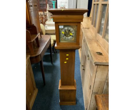 A vintage mahogany grand daughter clock 