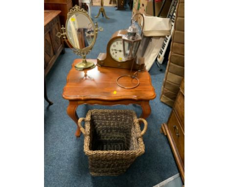 A vintage oak mantel clock, together with a coffee table, brass effect mirror, lamp and wicker bin