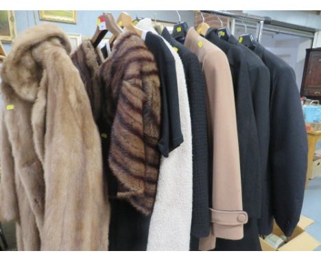 A rail of vintage clothing to include a vintage Wright &amp; Son fur bolero jacket, a gents dinner jacket and trousers etc