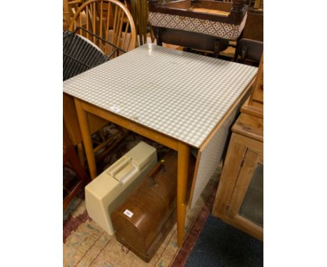 A vintage Formica dropleaf kitchen table 