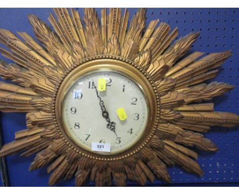A vintage sunburst wall clock S/D 