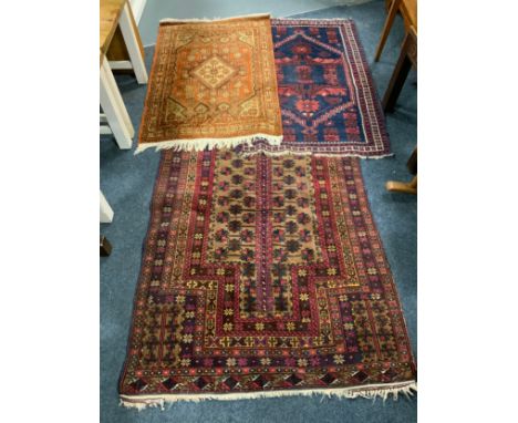 A vintage Kayam rug together with two additional Eastern woollen rugs. (3) 