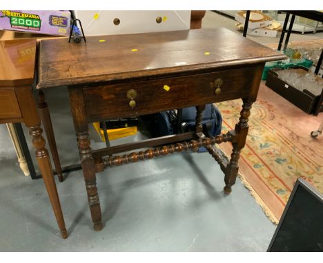 An antique oak single drawer side table with bobbin supports W 91 cm 