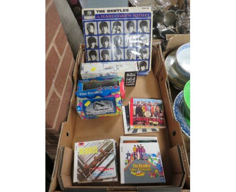 Beatles interest - to include three boxed diecast vehicles, a set of 'Studio Albums' on CD and a first pressing 'A Hard Day's