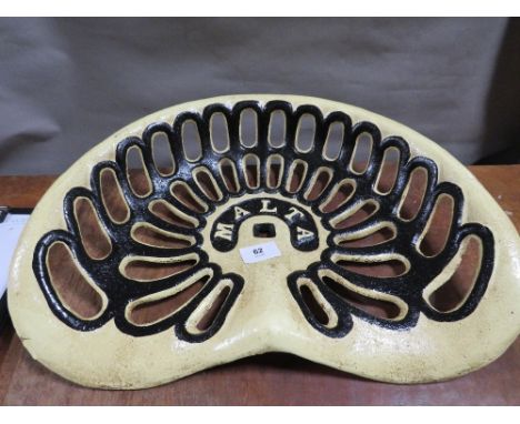 **A modern Malta cast metal tractor seat**