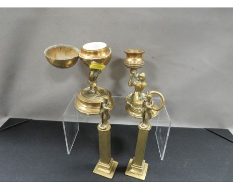 A Victorian brass inkwell in the form of a Gnome holding a globe, a pair of napoleon figure topped columns and a classical st