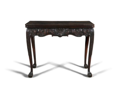 A FINE IRISH GEORGE III MAHOGANY TEA TABLE, with rectangular fold over top with rounded corners, plain interior over a masked