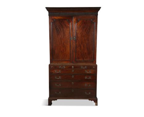 AN IRISH GEORGE III SECRETAIRE BOOKCASE,the rectangular two door top surmounted with a blind fretwork cornice above fielded p