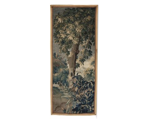 A FRENCH AUBUSSON VERDUE TAPESTRY, 18TH CENTURYwoven with a woodland scene within an oblong field contained within a taupe an