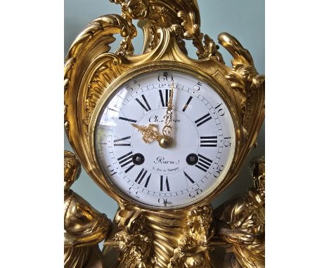 ***ADDITIONAL LOT*** A FRENCH ROCOCO STYLE THREE-PIECE ORMOLU CLOCK GARNITURE,inscribed 'Ch. Drieu, Paris', the clock cast wi